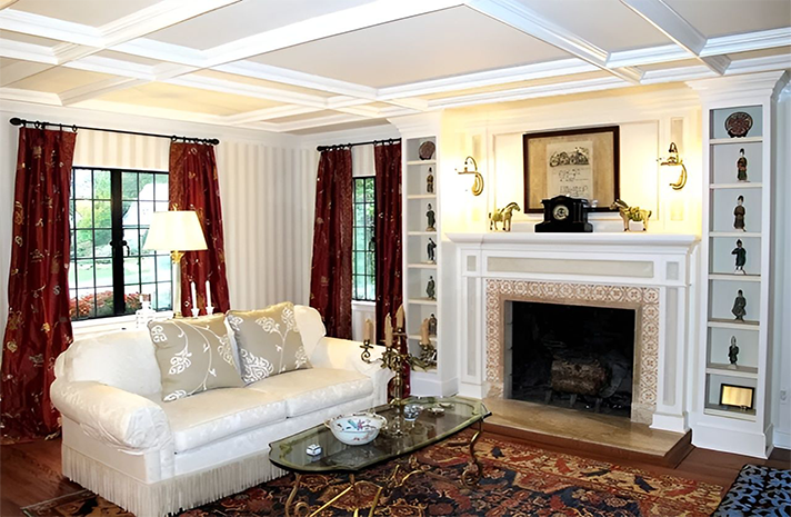 A living room with a fireplace and a couch