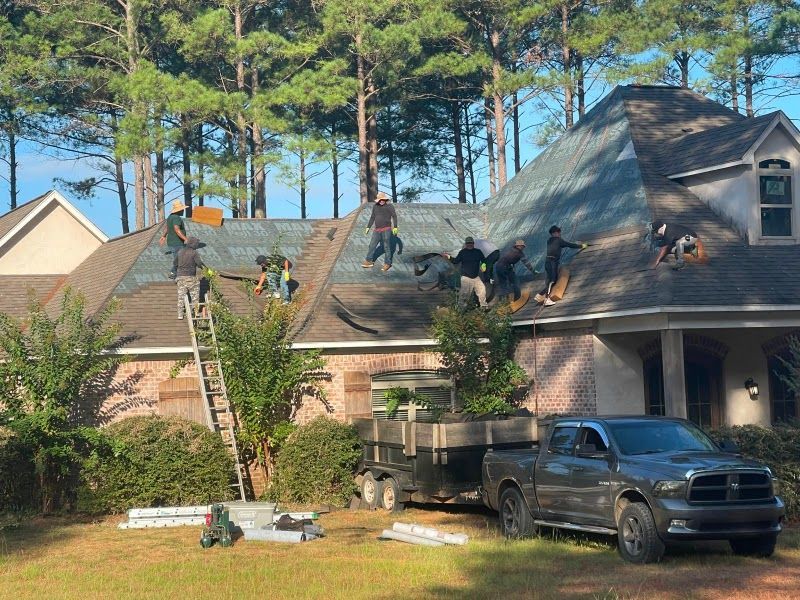 A truck is parked in front of a house that is being remodeled.