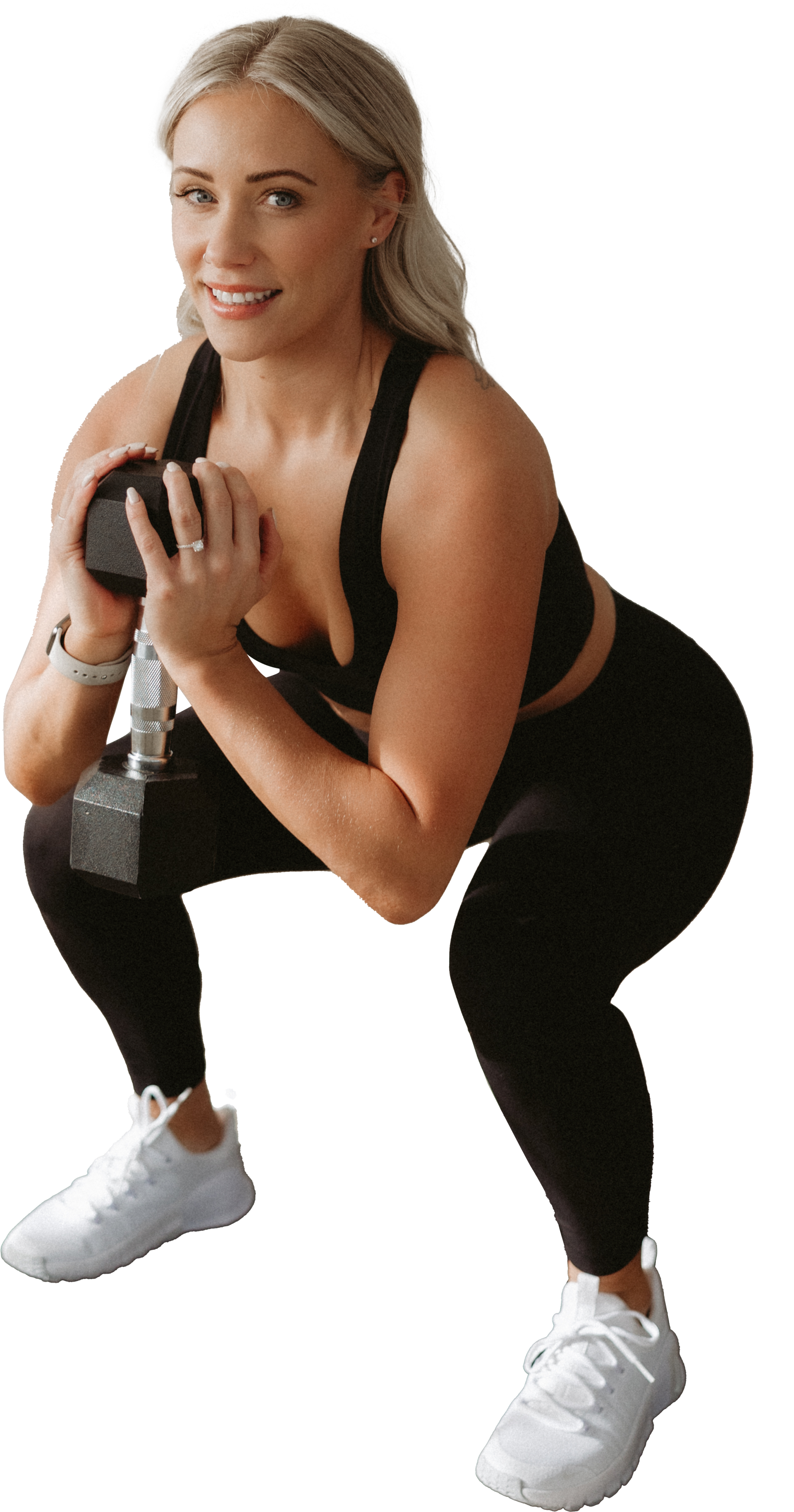 A woman is holding a black ball in her hands and smiling. Forever Fit - Personalised Workouts and Nutrition - Terrina Brewer
