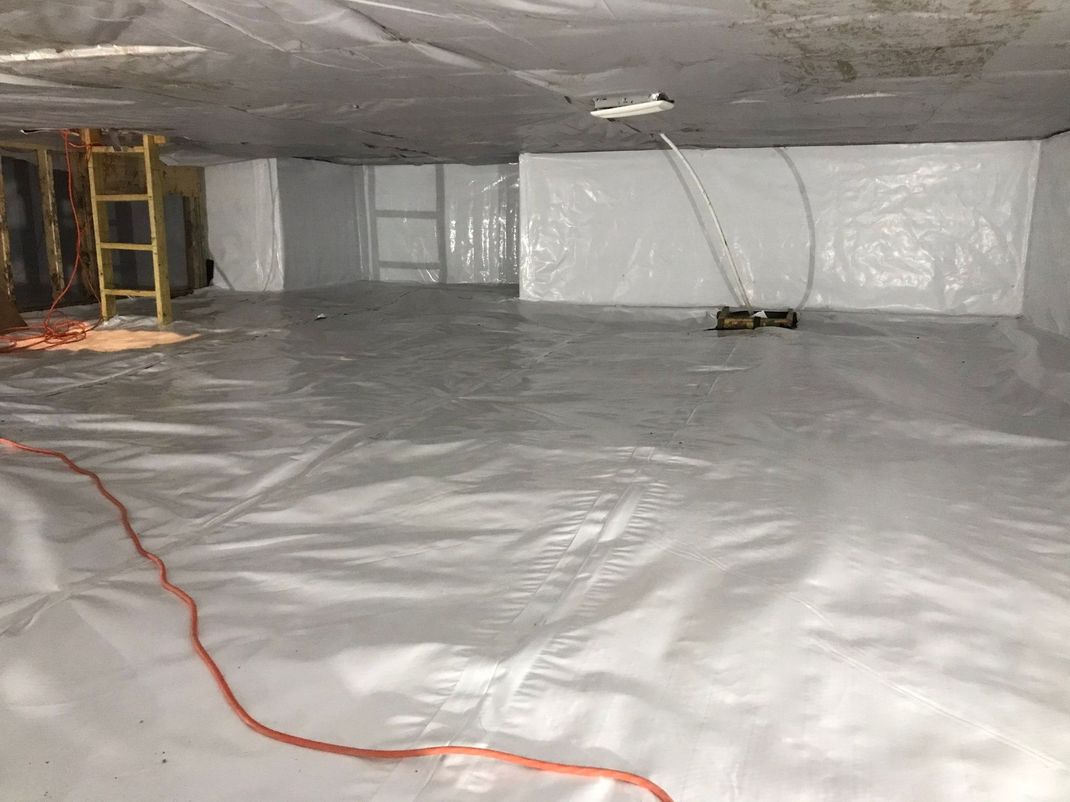 photo of crawlspace encapsulated with white material