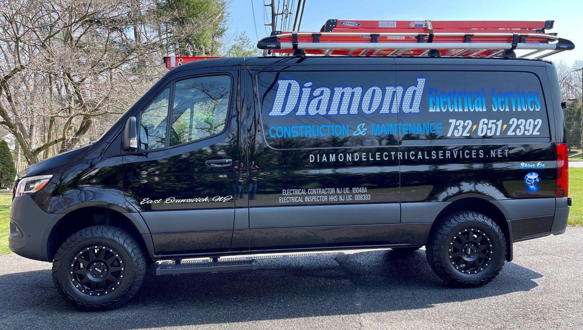 Black Diamond Electrical Services van with ladder on roof; 732-651-2382 phone number.
