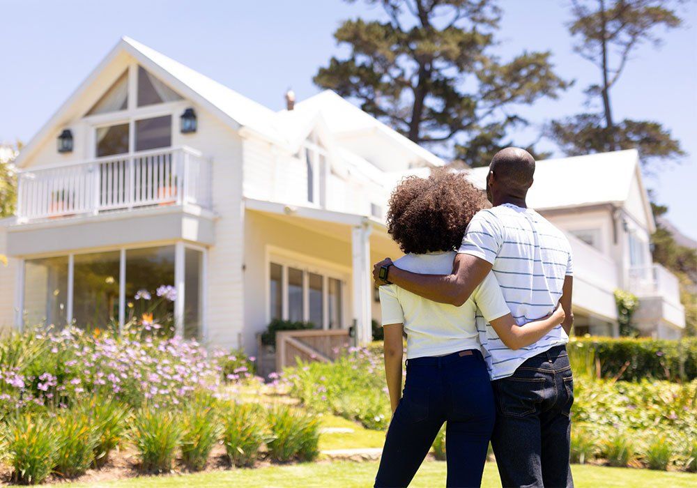 Couple Looking At their House — Holmdel, NJ — Gerstel Homes