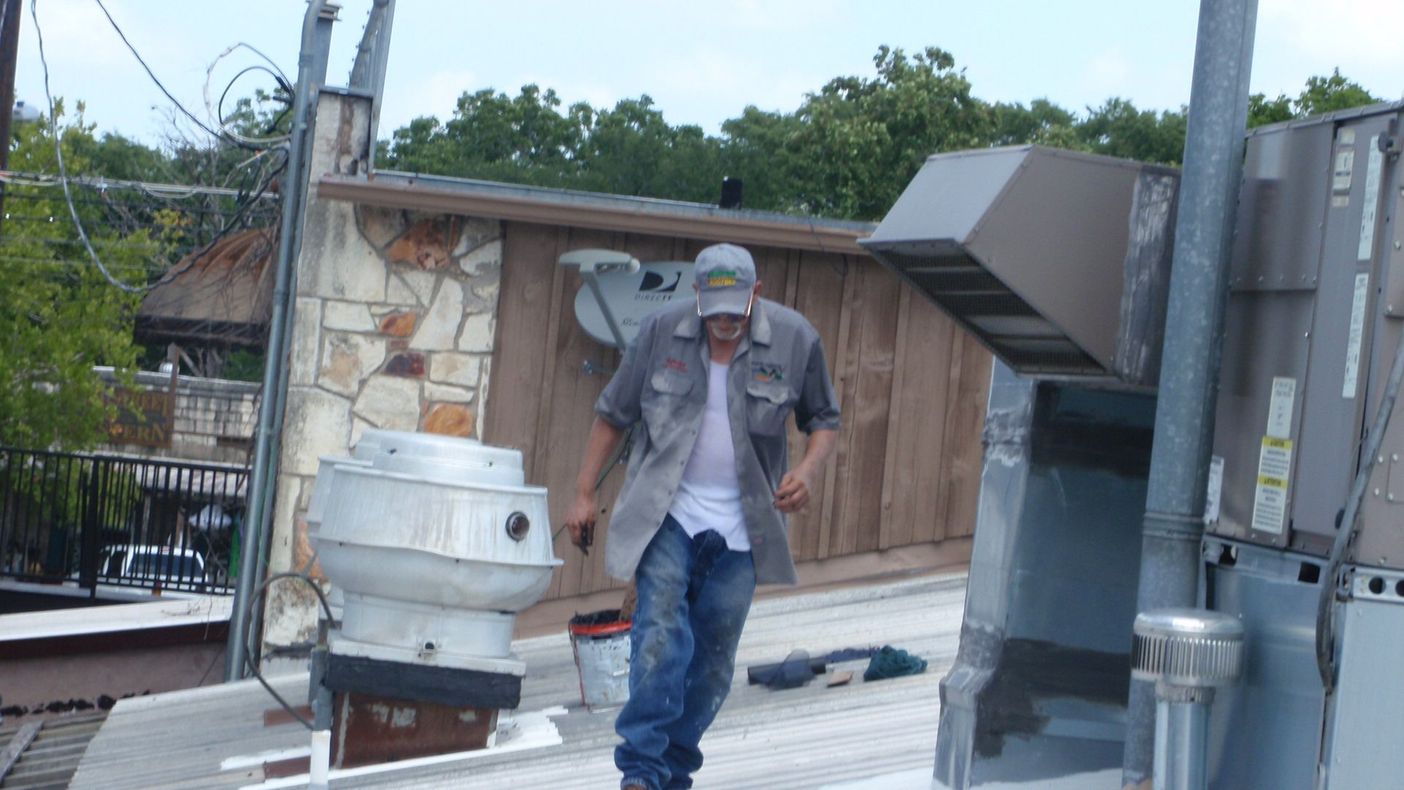 Roofing Expert On Roof