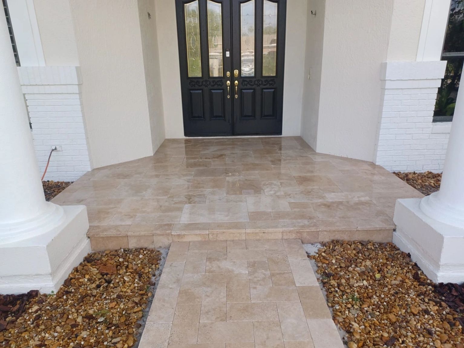 A red brick walkway with a herringbone pattern