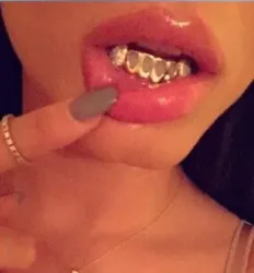 Girl with gold custom grill
