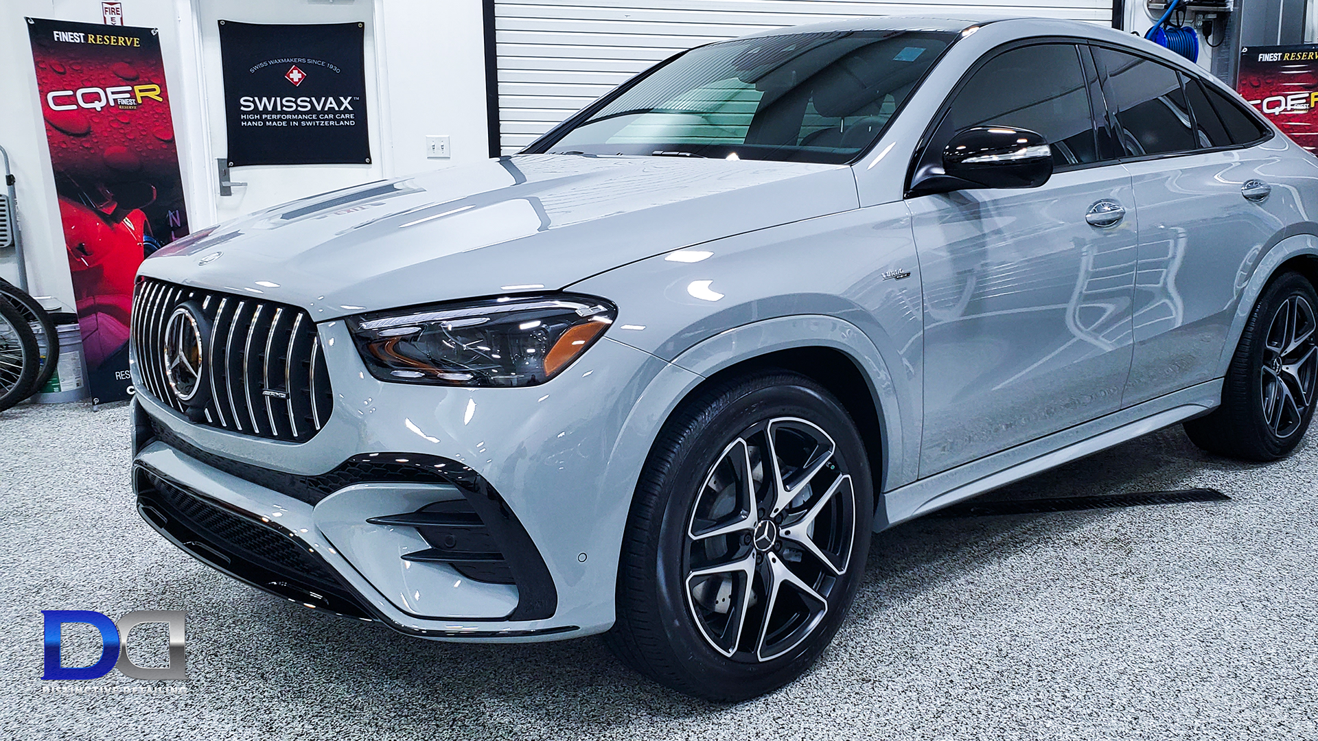 Gray Mercedes-AMG GLE Coupe parked inside. Black accents, black and silver wheels, garage setting.