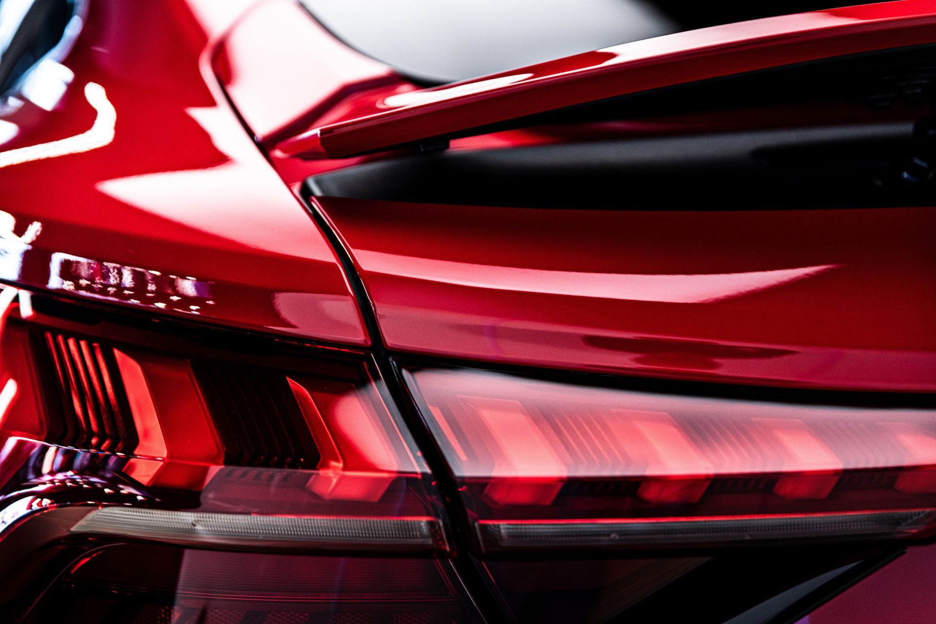 A close up of a red car 's tail light