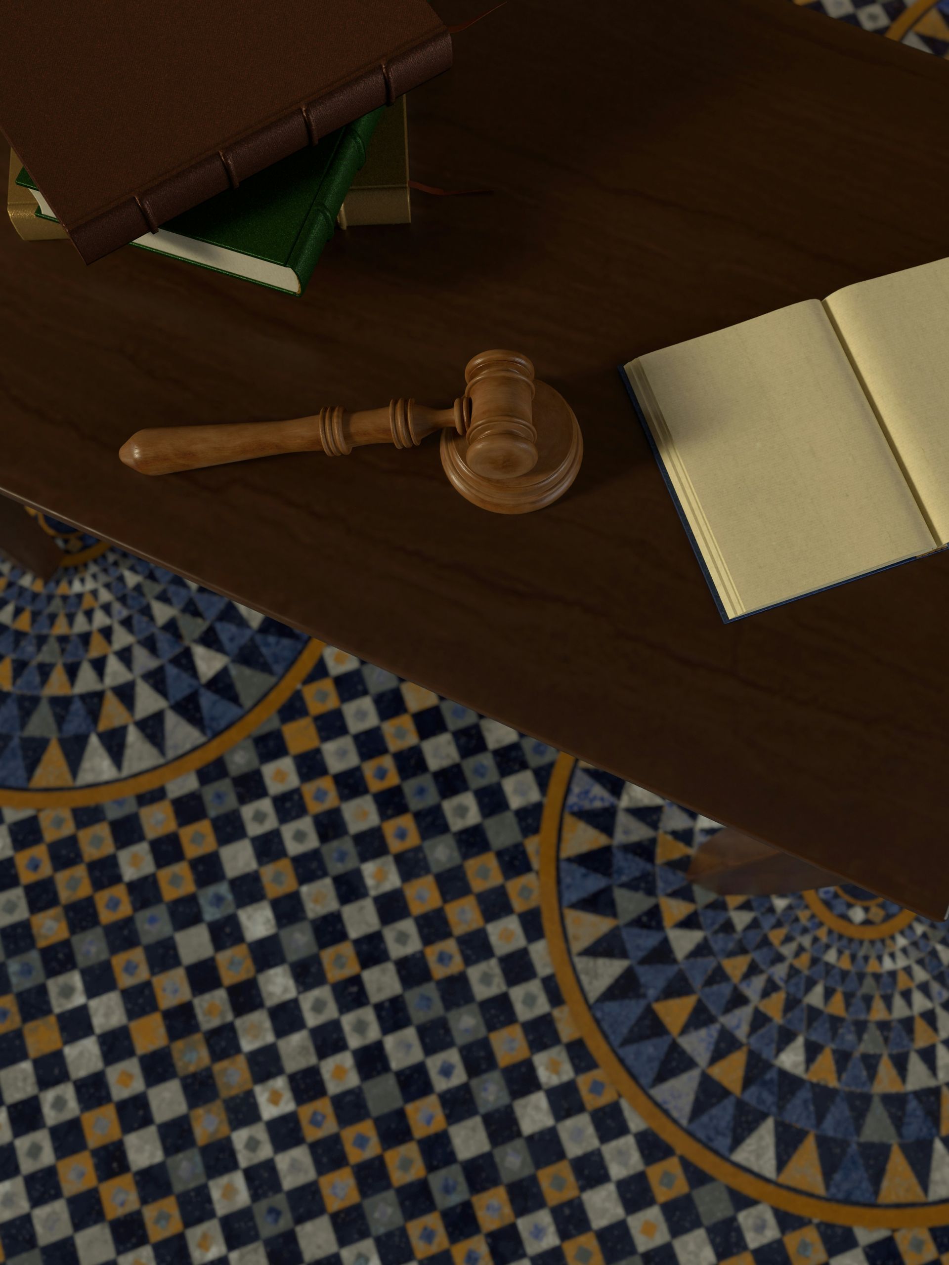 A wooden judge 's gavel sits on a wooden table next to an open book