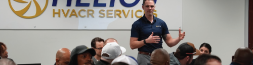 A man is giving a presentation to a group of people.