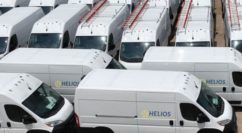 A row of white vans with helios written on the side