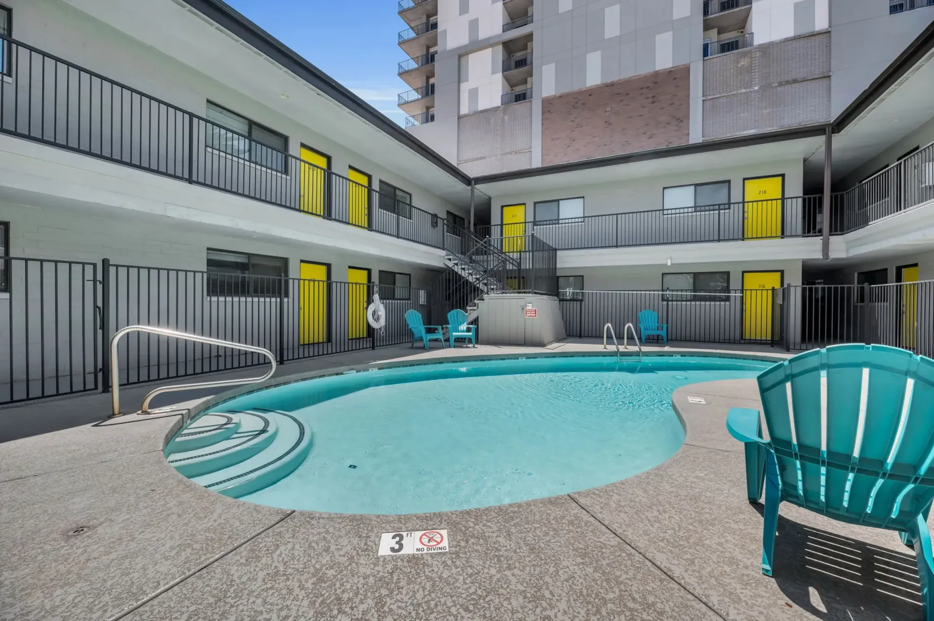 a swimming pool with a sign that says no diving