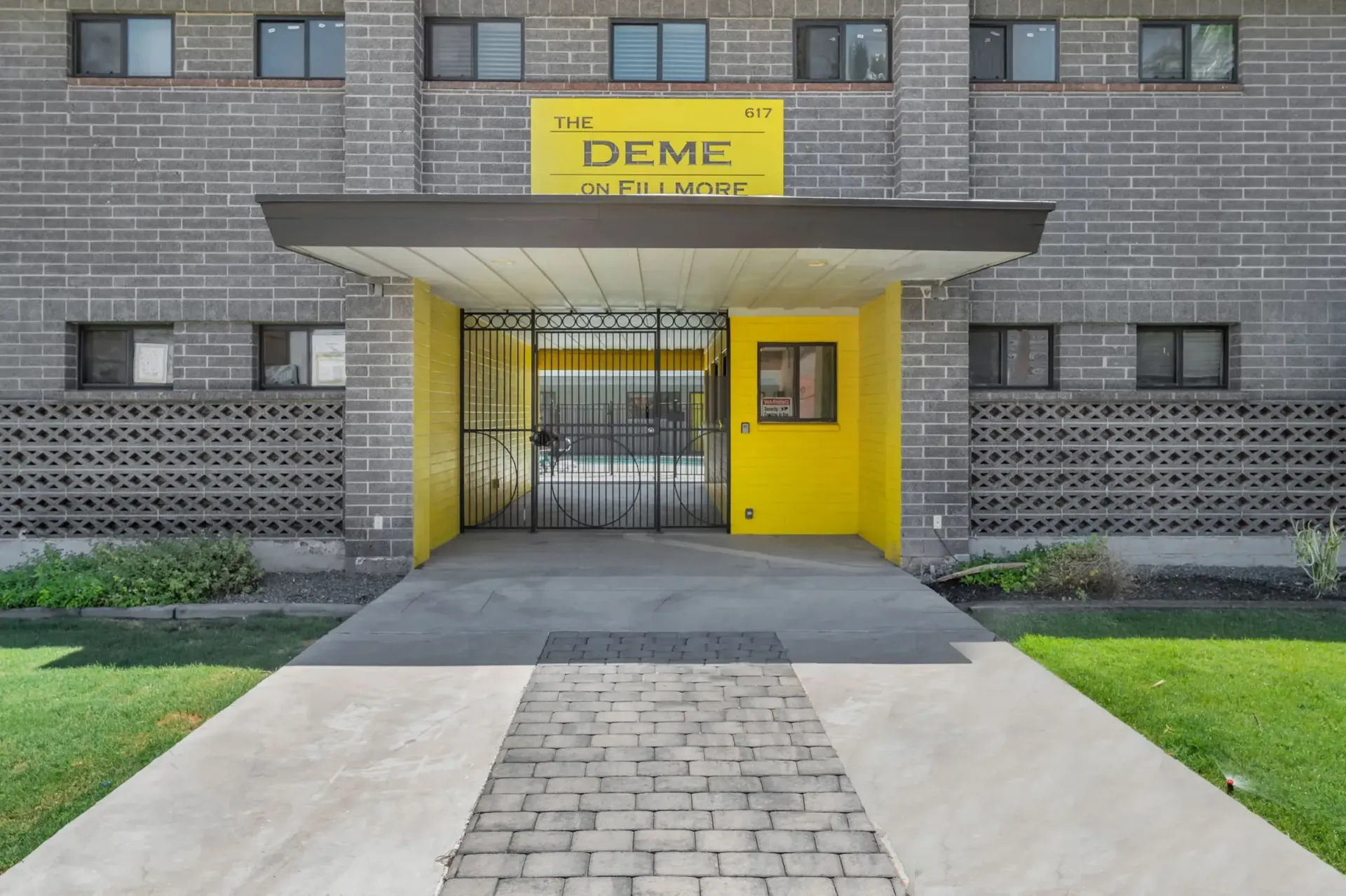 a building with a sign that says the deme on fill more