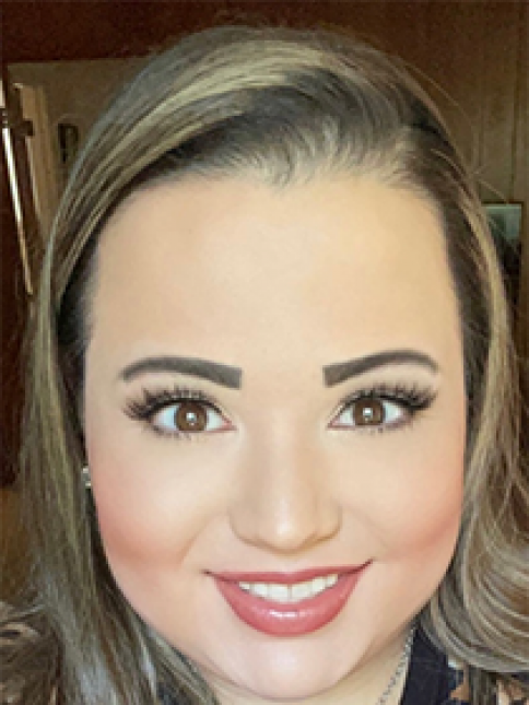 A close up of a woman 's face with a smile on her face.