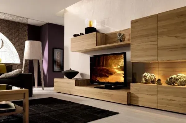 A living room with a fireplace and a flat screen tv