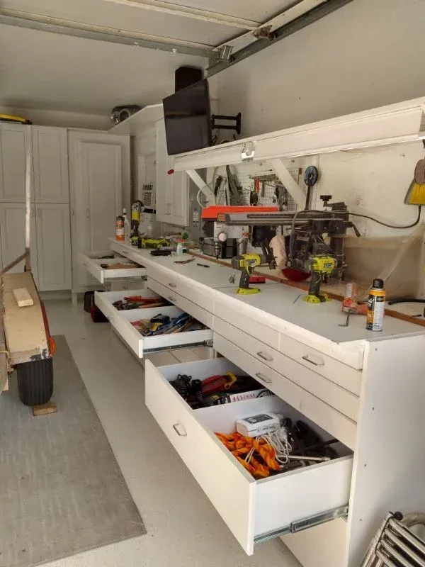 A garage with lots of drawers filled with tools