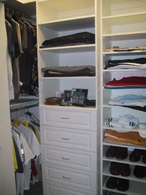 A closet filled with lots of clothes and shoes