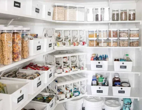A pantry filled with lots of food and containers.