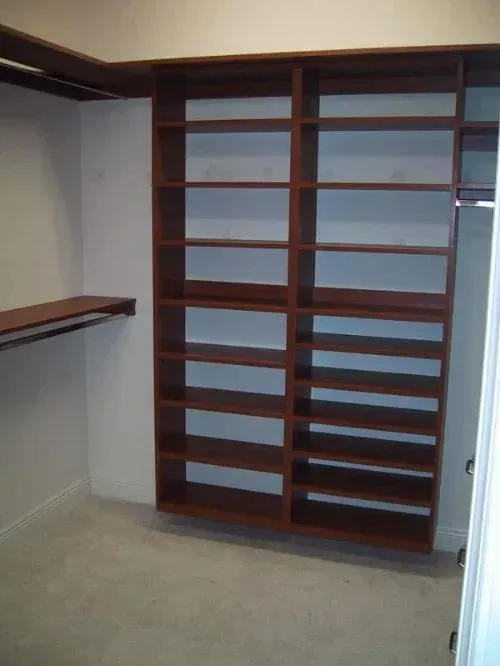 A walk in closet with a lot of shelves