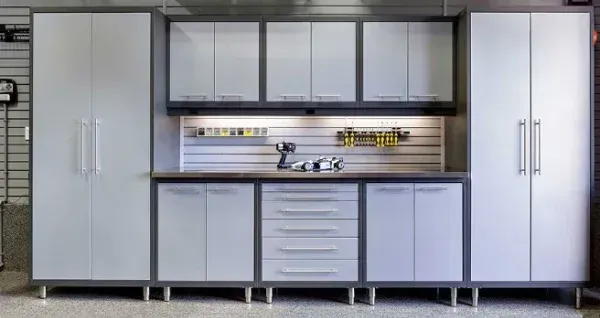 A garage with a lot of cabinets and drawers