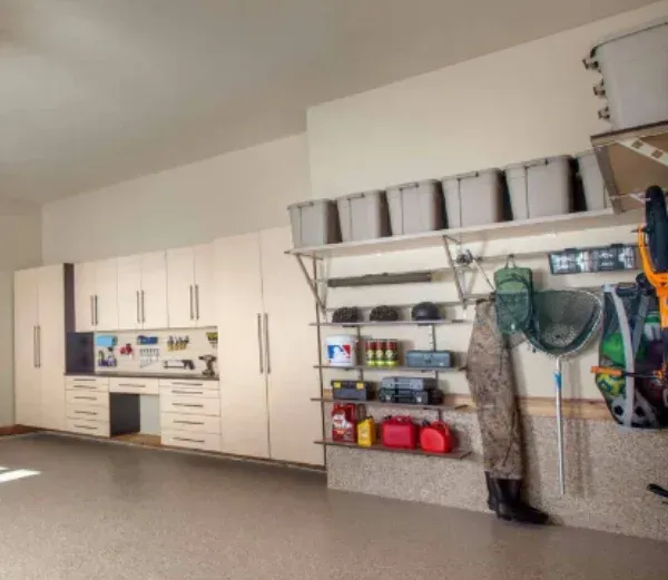 A large garage with lots of shelves and cabinets