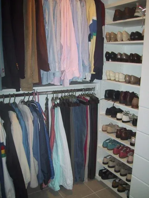 A closet filled with lots of clothes and shoes