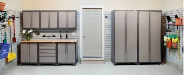 A garage filled with lots of cabinets and shelves.