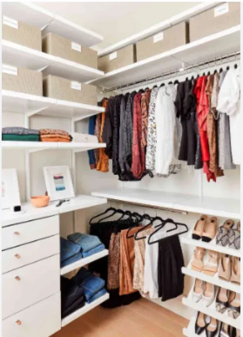 A walk in closet filled with clothes and shoes