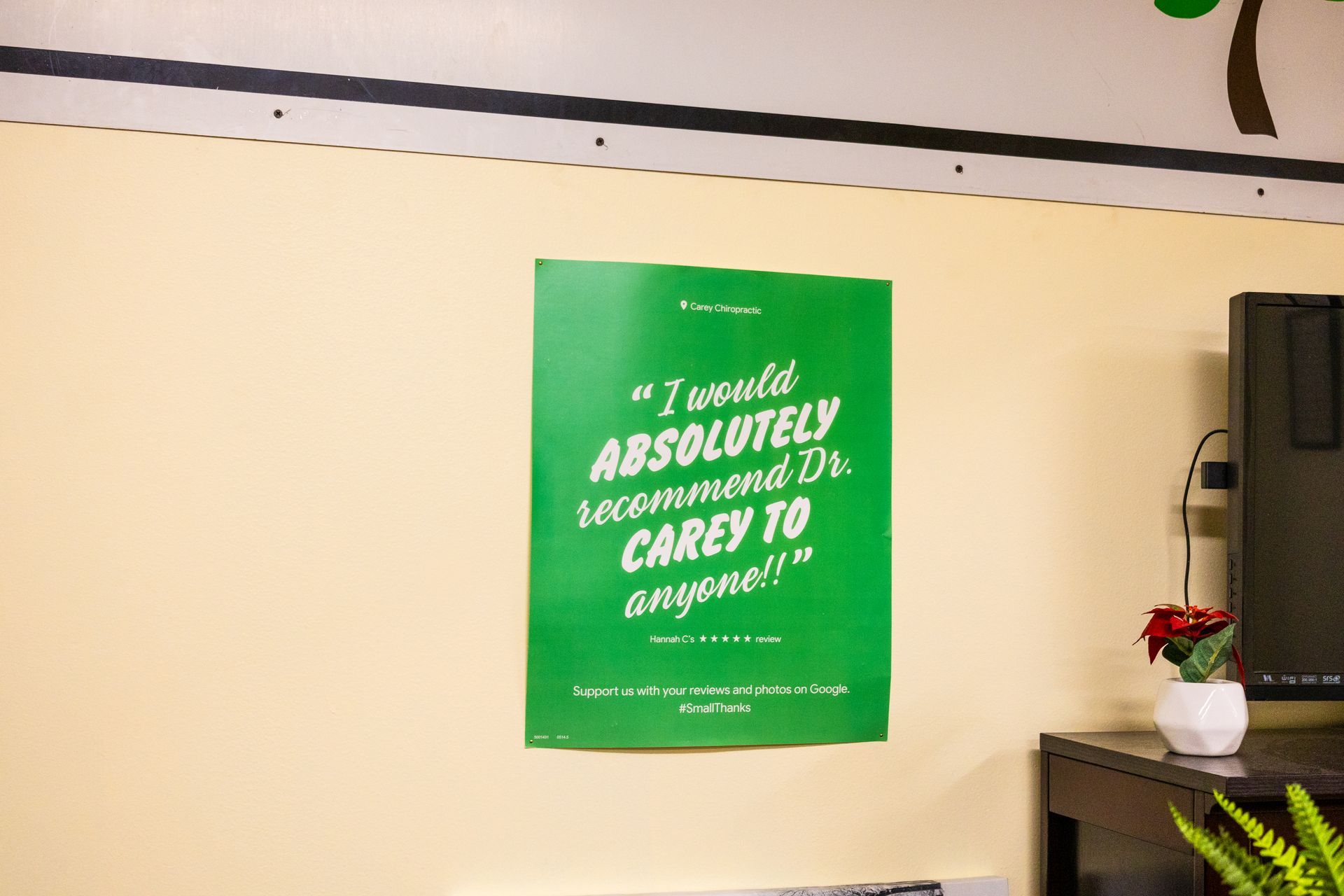 Green poster on a cream wall: 