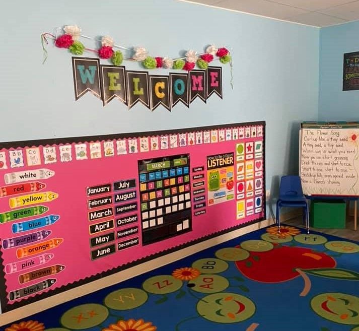 A classroom with a welcome banner on the wall
