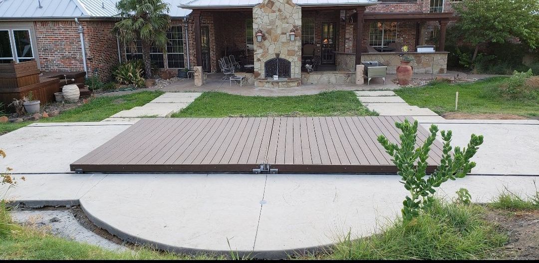 A large house with a wooden deck in front of it
