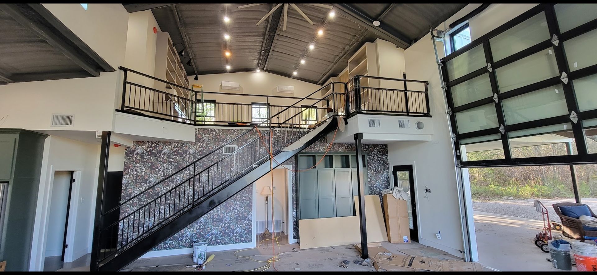 A large house with a staircase leading up to the second floor.