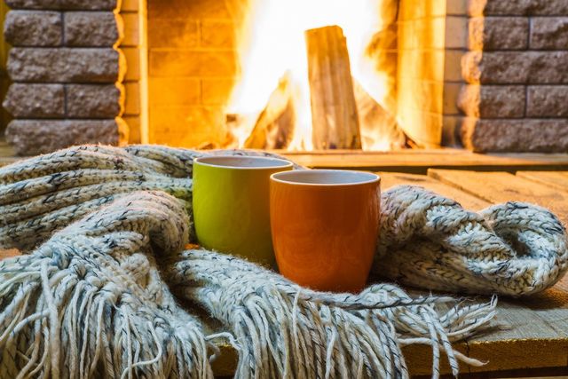 Mugs for tea near fireplace