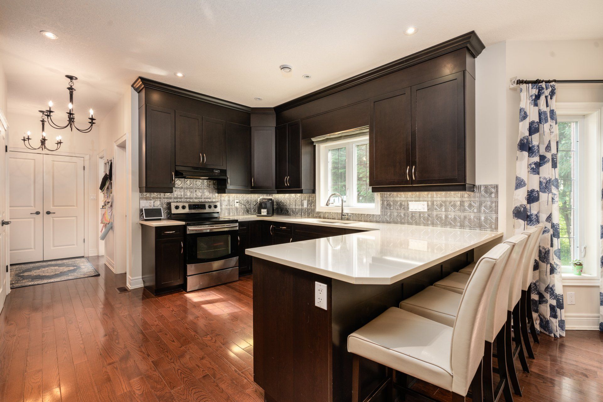 A kitchen with a large island in the middle of the room.
