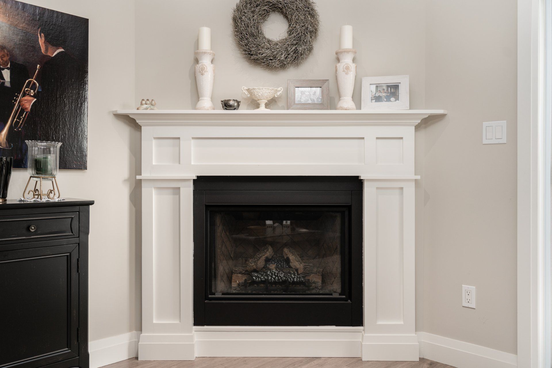 There is a fireplace in the corner of the room.