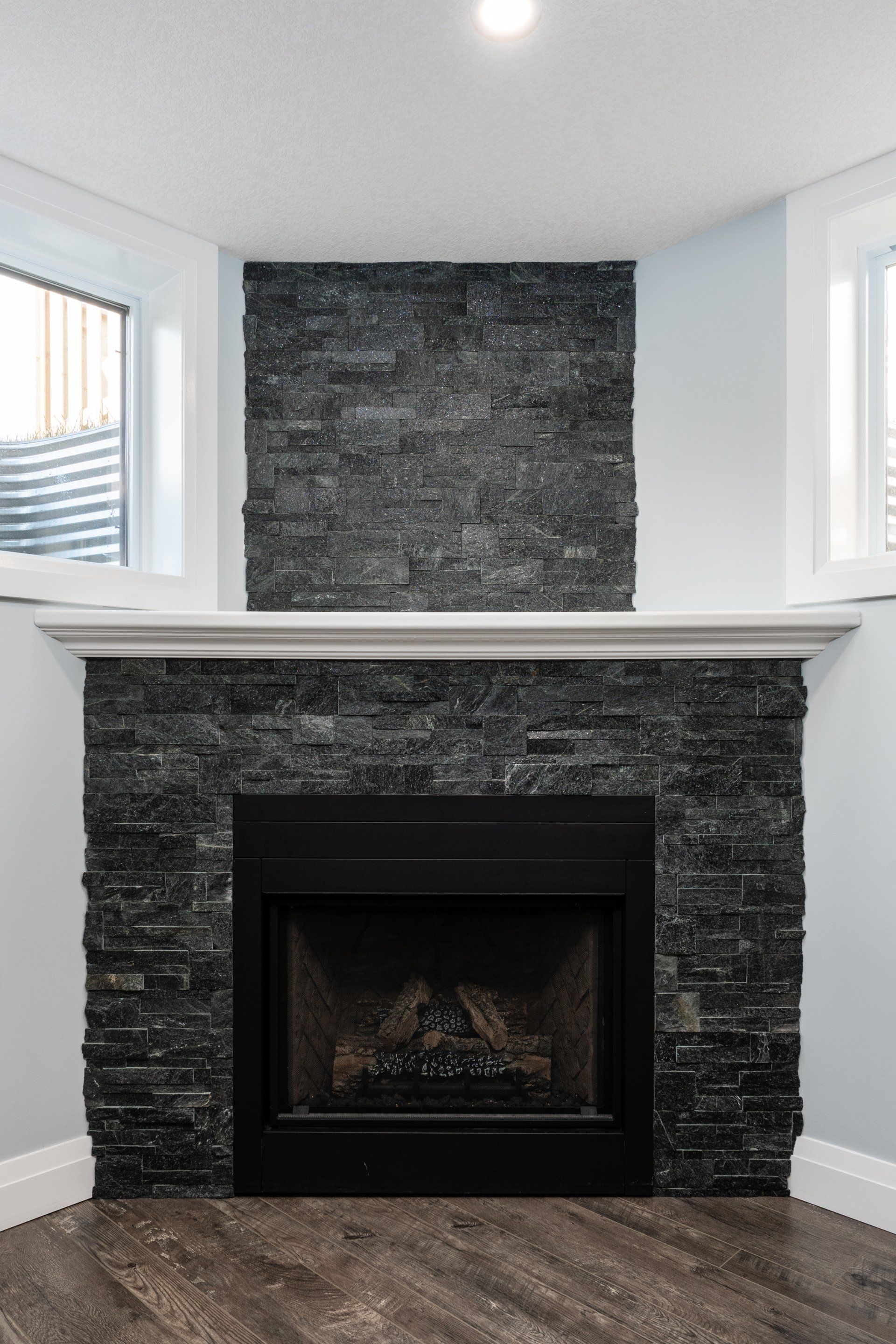 There is a fireplace in the corner of the room.