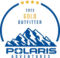 A logo for polaris adventures with a mountain in the center