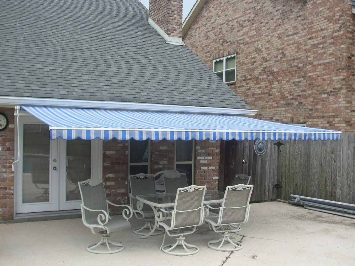 Retractable Awnings — Retractable Awning With Blue And White Stripes in Chalmette, LA
