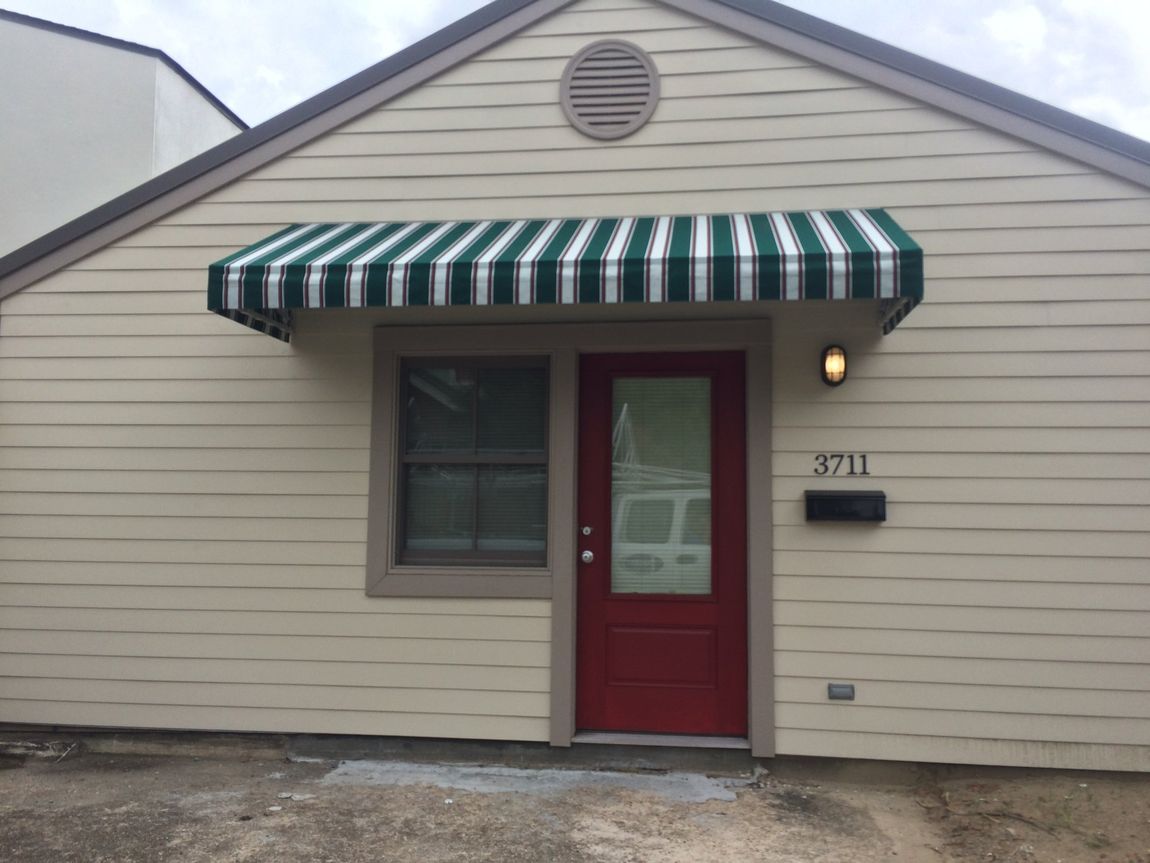 Welded Aluminum Frames — House With A Green Striped Awning in Chalmette, LA