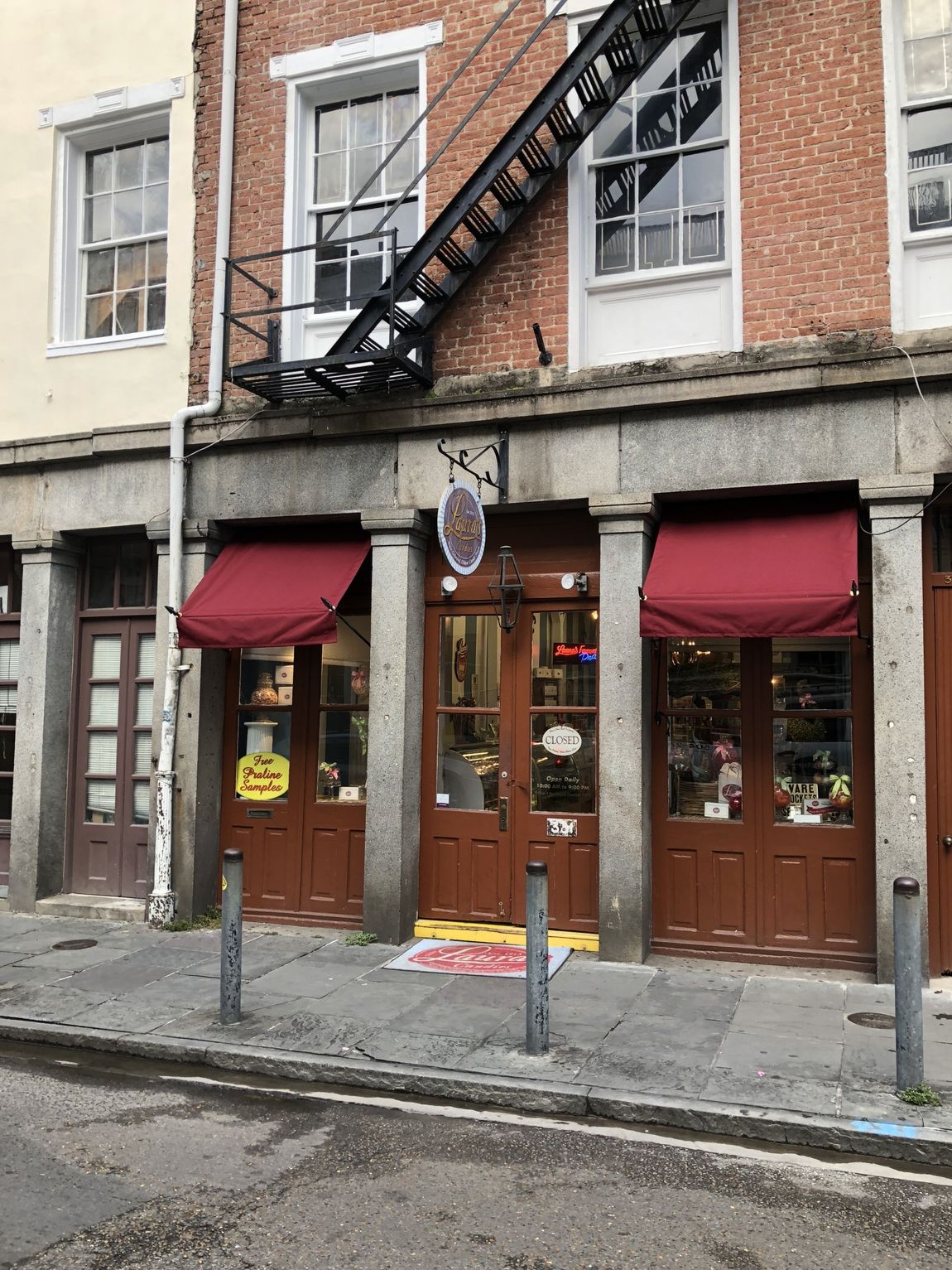Foster Commercial Awnings — Red Awnings Installed On A Shop in Chalmette, LA