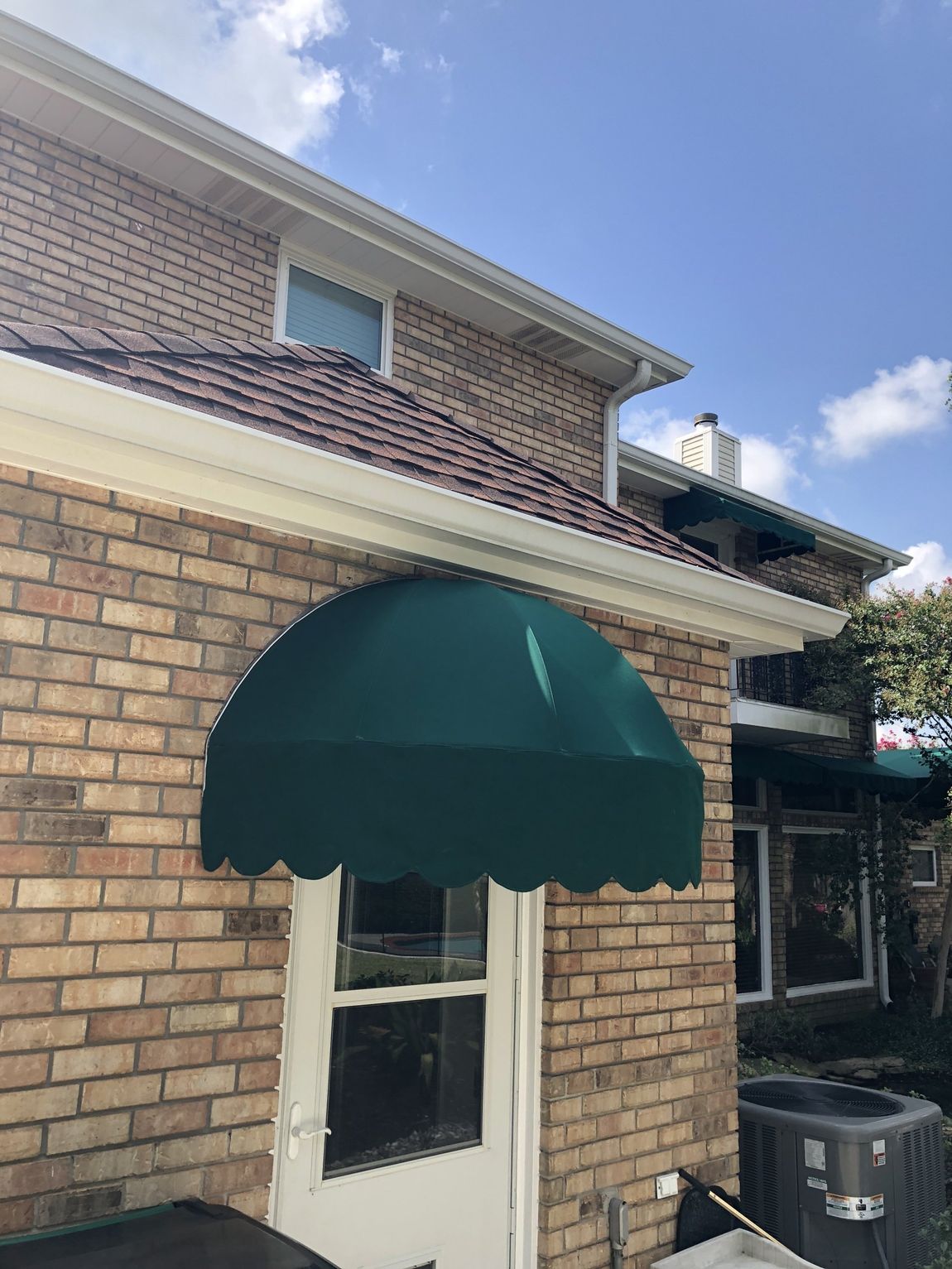 Canopy Designs — Black Oval Canopy Installed On A Door in Chalmette, LA