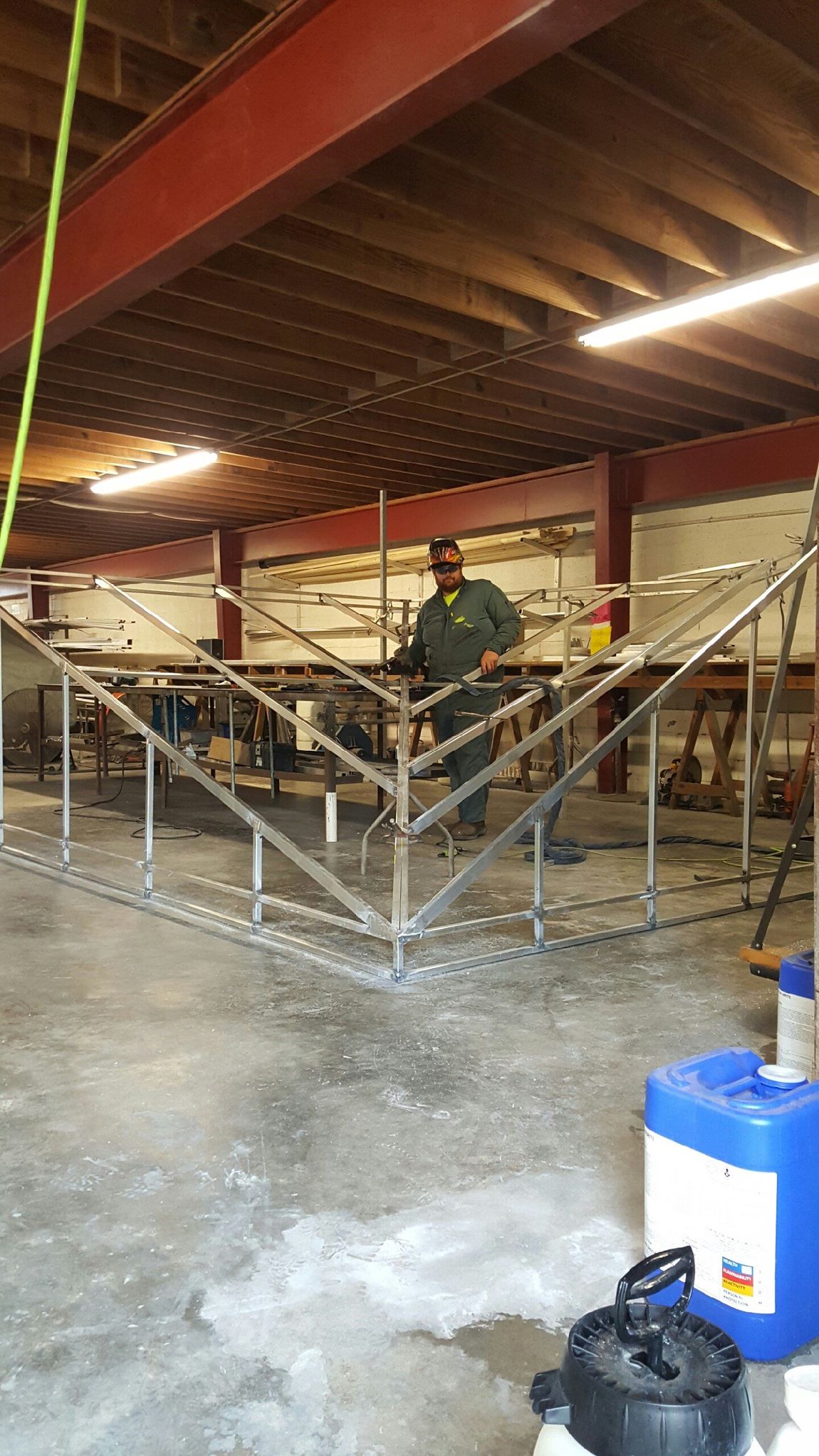Under Construction — Canopy Being Built By A Worker in Chalmette, LA