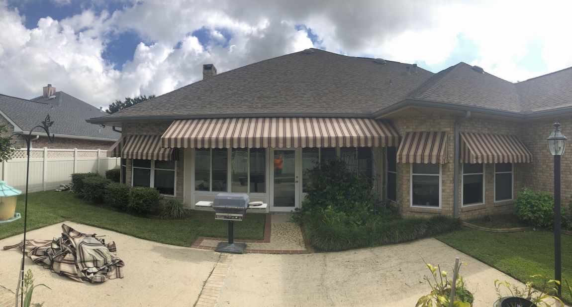 Residential Awnings — A House With Awnings Installed On The Door And Windows In Chalmette, LA