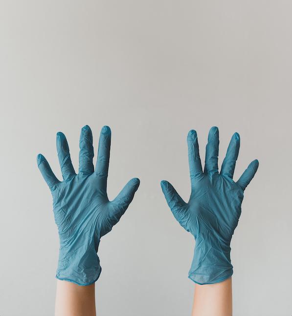Hands With Cleaning Gloves — Cleaning Services in Airlie Beach, QLD