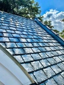 A close up of a slate roof with a blue sky in the background – Sheridan, WY – Storm Pro Solution