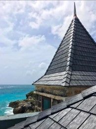 A roof with a pyramid-shaped roof overlooking the ocean – Sheridan, WY – Storm Pro Solution
