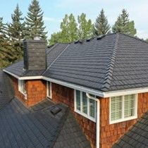 Aerial view of a house with a black roof and a chimney – Sheridan, WY – Storm Pro Solution