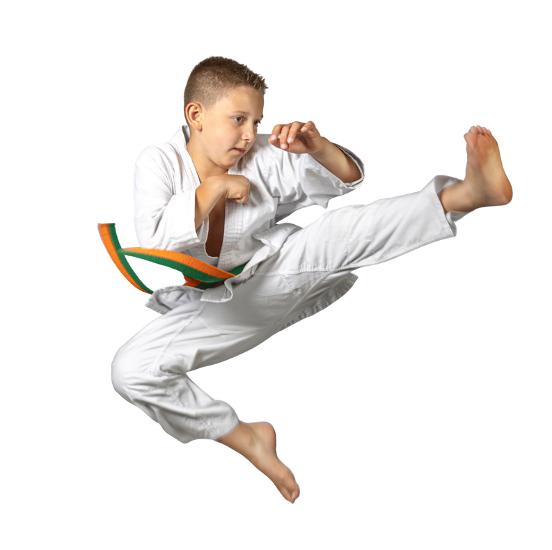 Child in a white martial arts uniform performing a high kick in midair on a white background