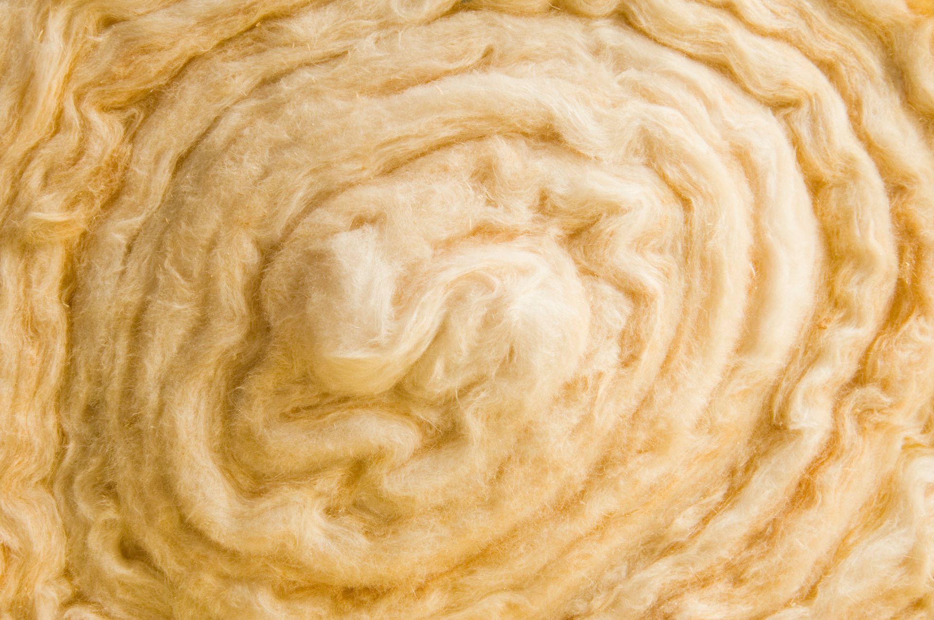 A close up of a roll of wool insulation.