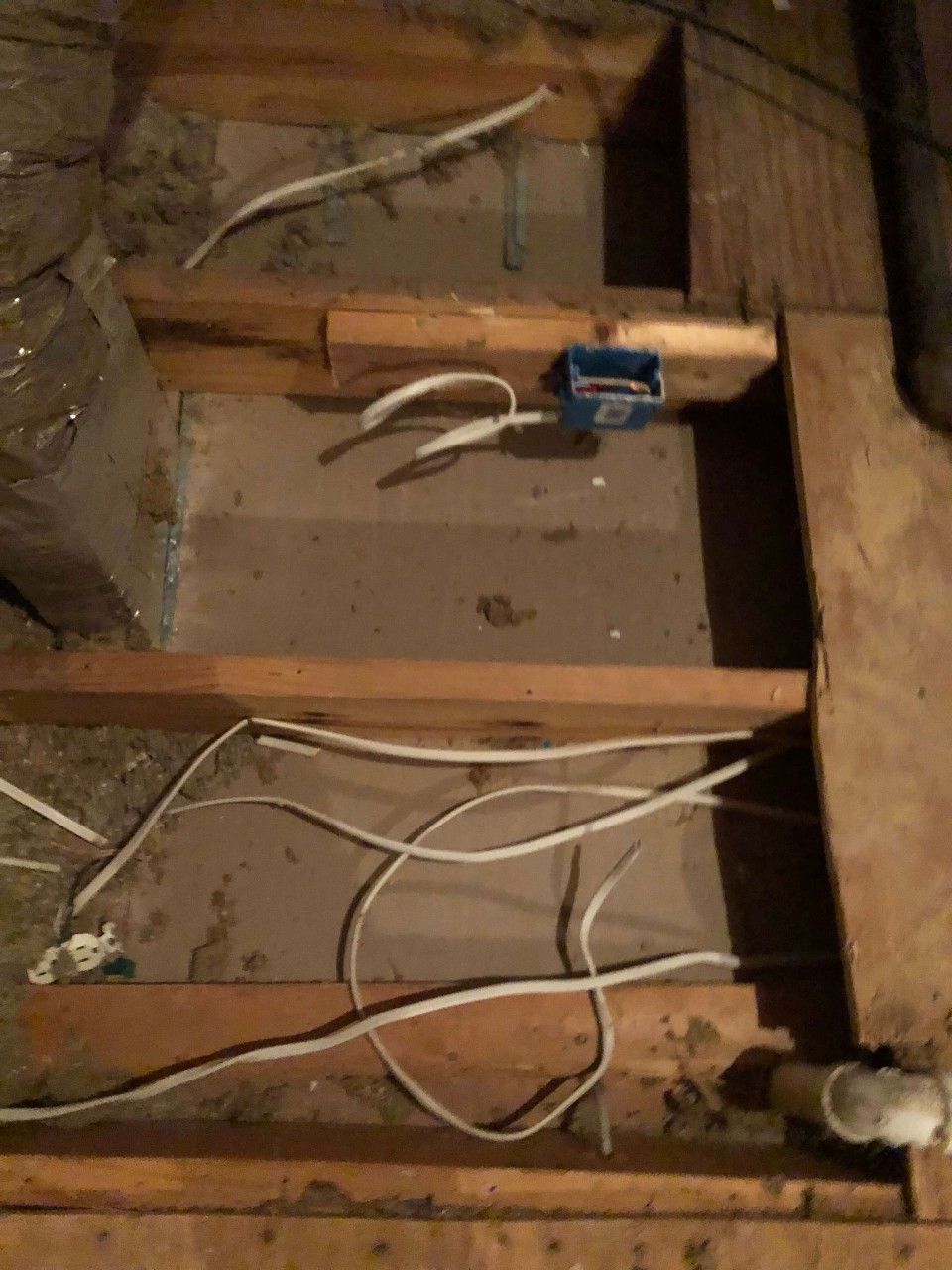 A wooden box with a bunch of wires coming out of it.