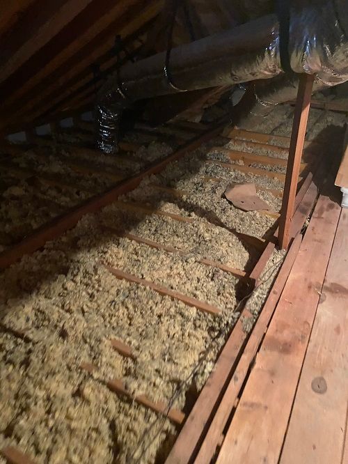 Insulation in the attic of a house.